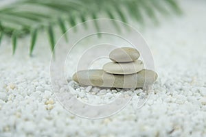 Pyramids of gray and white zen pebble meditation stones on white background. Concept of harmony