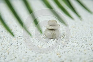 Pyramids of gray and white zen pebble meditation stones on white background. Concept of harmony