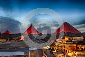 The Pyramids at night, view from Giza buildings, Egypt