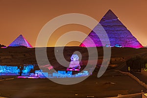 The Pyramids and the Sphinx in the night lights, Giza, Egypt