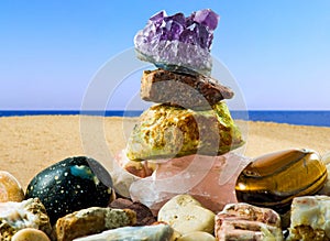 Pyramids of stones against the background of the sea are a symbol of calm and balance