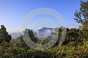 Pyrenees mountain peak landscape on a solid blue sky