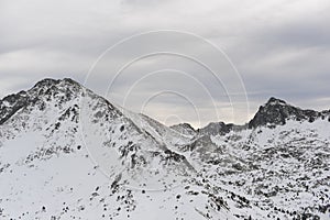 Pyrenees mountains range in winter with snowy peaks in Grandvalira ski paradise resort in Andorra