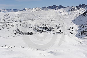 Pyrenees mountains range in winter with snowy peaks in Grandvalira ski paradise resort in Andorra