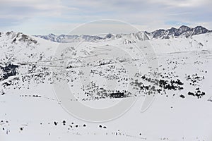 Pyrenees mountains range in winter with snowy peaks in Grandvalira ski paradise resort in Andorra