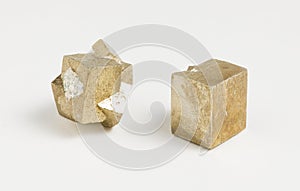 Pyrite cubes on white background.