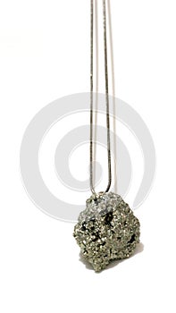 Pyrite gem, pyrite stone. Necklace on black background. Vertical imagem