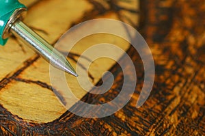 Pyrography pen over burned wood