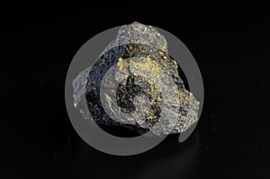 Pyrrhotite mineral stone on black background