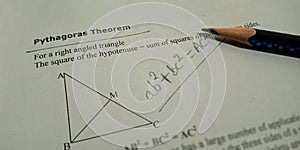 Pythagorean theorem with geometric diagrams displayed on white background with pencil