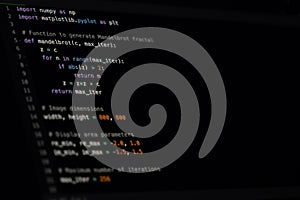 Python Code Dark Theme IDE on Monitor Screen