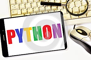 Python. Computer programming language. The inscription on the smartphone screen.