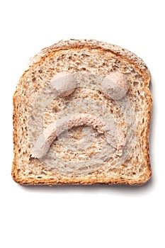 PÃÂ¢tÃÂ© spread smiley on slice of bread photo