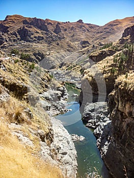 Q`eswachaca, a bridge made of grass, hanging over the Apurimac river. Quehue, Cusco, Peru photo