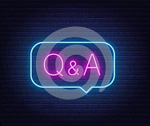 Q and A Neon Sign in speech bubble on brick wall background.. photo