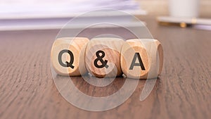 Q and A - Question and Answer word concept on cubes photo