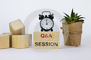 Q and A, questions and answers session symbol. Concept words `Q and A session` on wooden blocks on a beautiful white background.