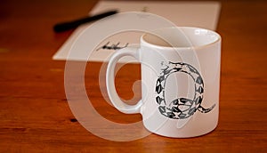 Qanon symbol on white mug on wooden desk, conspiracy theory, deep state conservative concept