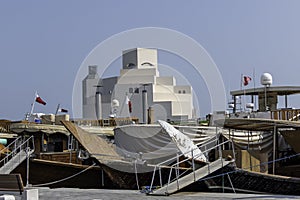 Qatar, Doha, traditional wooden Arab dhow in front Doha of Museum of Islamic Art photo