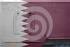 Qatar flag depicted on side part of military armored truck closeup. Army forces conceptual background