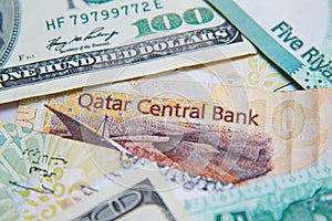 Qatari riyals and American dollars,