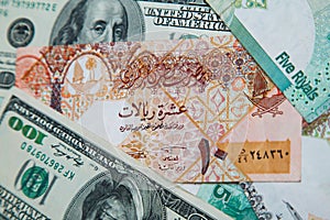 Qatari riyals and American dollars,