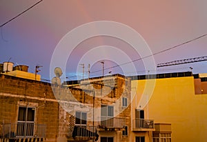 Qawra, Malta 30. may 2019 - rainbow over the residential buildings