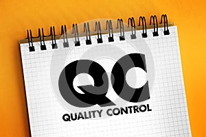 QC Quality Control - process by which entities review the quality of all factors involved in production, acronym text concept on