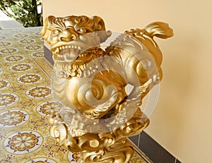 Qilin asian golden mythological statue