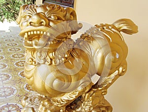 Qilin asian mythological golden statue