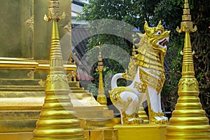 Qilin mystic asian animal guard statue in Thailand temple Wat