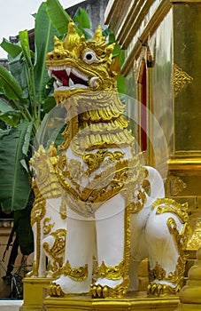 Qilin mystic asian animal guard statue in Thailand temple Wat