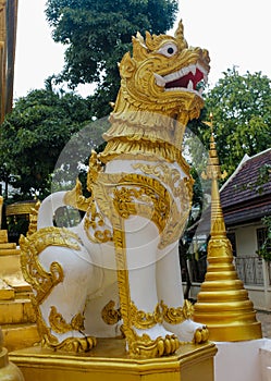 Qilin mystic asian animal guard statue in Thailand temple Wat