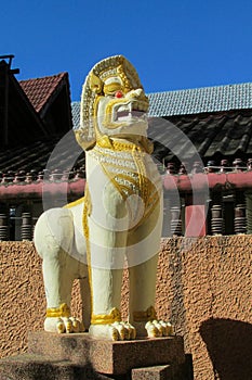 Qilin mystic asian animal guard statue in Thailand temple Wat