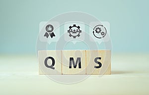 QMS, Quality management system concept. Formalized system for achieving quality policies and objectives. ISO 9001 standard. Wood