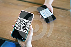 Qr code payment. Woman scanning QR code online shopping cashless technology concept