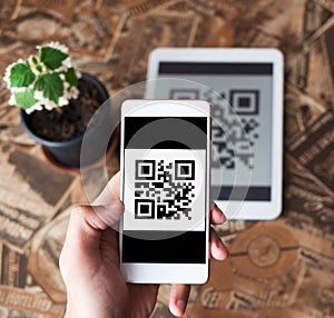 QR code payment transaction using mobile smartphone and tablet devices photo