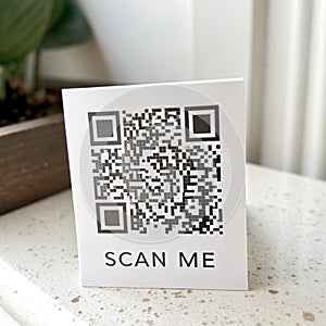 QR code 'Scan Me' isolated on white background