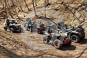 Quad ATV cars all terrain vehicle parked on mountain road