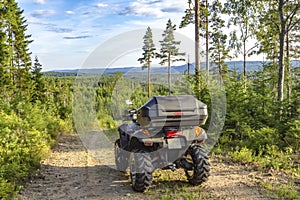 Quad / ATV on a dirt road somewhere in a Swedish forest