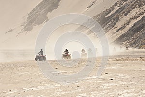 Quad bike safari through a desert landscape