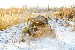 Quad bike on a winter in field off road