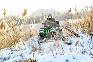 Quad bike on a winter in field off road