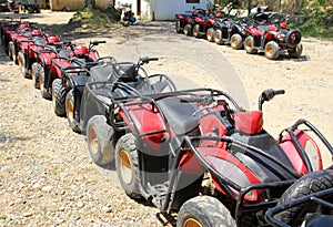 Quad bikes atv in row