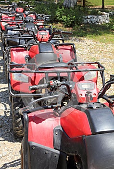 Quad bikes atv in row