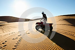 Quad Biking Silhouette - Merzouga - Morocco photo