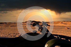 Quad on a desert safari in Egypt with dramatic skies