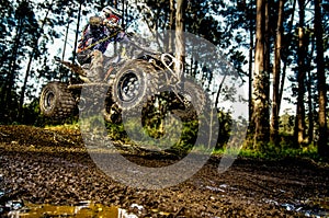Quad rider jumping