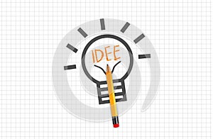 Quad or squared paper with pencil light bulb or lightbulb with idea idee