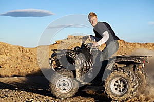 Quad - teen driving four wheeler